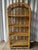 Solid wicker with rattan accent. Four shelves at different heights. 11-12 inches height in between shelves