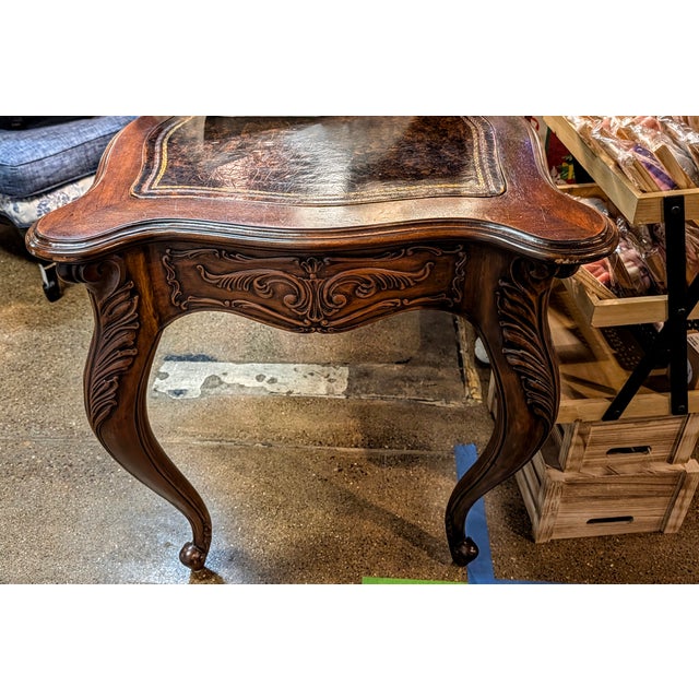 This exceptional antique French Provincial library table or desk is a masterclass in classic Louis XV style craftsmanship....