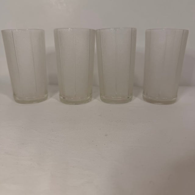 Vintage frosted glass tumblers featuring a unique textured pebbled finish accented by vertical clear ribs. This set of...