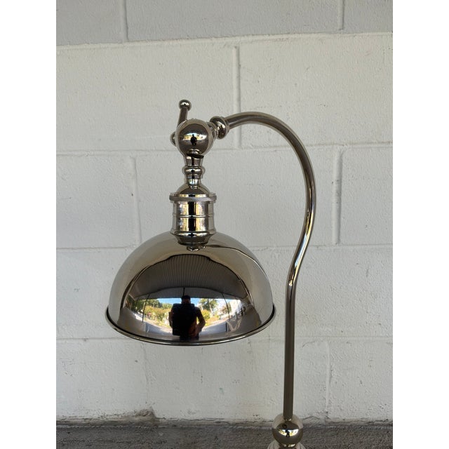 Stylish Currey & Co Polished Nickel Desk Lamp . Square base, with adjustable shade position. Showroom floor sample.