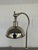 Stylish Currey & Co Polished Nickel Desk Lamp . Square base, with adjustable shade position. Showroom floor sample.