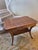 Biedermeier style rectangle end table. The table made with warm toned walnut and has a planked top with borders, a single...