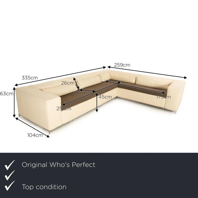 The Boston sofa from Who's Perfect is covered with a cream -colored real leather and stands on small metal feet. The...