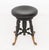 Victorian Ebonized Circular Piano Stool, circa 1900, with brass porpoise form feet. 18.5" H x 14" Diameter. Provenance:...