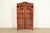 An exceptional antique Victorian bookcase cabinet In the manner of R.J. Horner & Co. USA, Circa 1880s Carved cherry wood,...