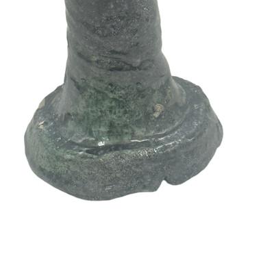 A Moroccan Tamegroute glazed candlestick holder is a handcrafted piece made in the historic pottery village of Tamegroute...