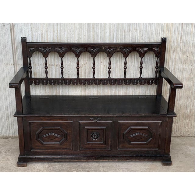 About This 17th century oak bench is richly carved with Gothic motifs. Despite its age, the piece has a very solid frame...