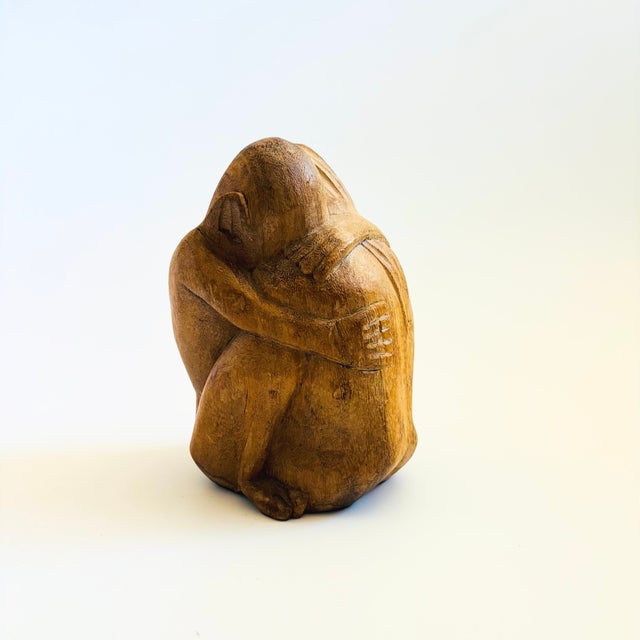 A vintage carved wood folk art sculpture of an embracing couple. Great stylized carved detailing of a man and woman. A...