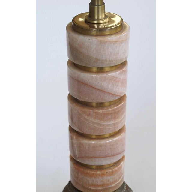 A good quality pair of French art deco rosso-pistalo marble columnar lamps with gilt-bronze and brass mounts; each column...
