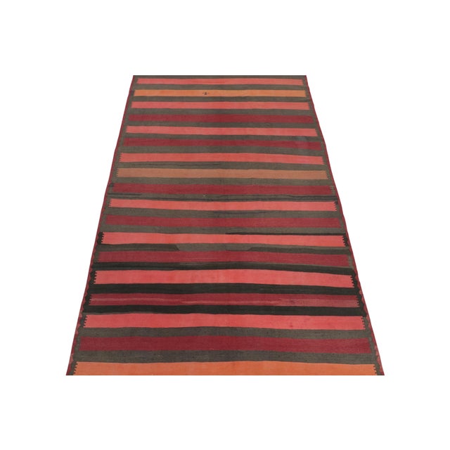 This vintage 7x12 Persian Kilim is a unique tribal rug for its period that hails from the Northwestern in Azerbaijan....