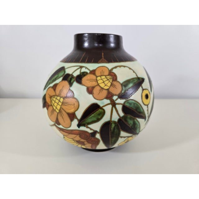An elegant spherical vase in fine glazed earthenware, designed by Charles Catteau for the Belgian manufacturer Boch Frères...