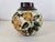 An elegant spherical vase in fine glazed earthenware, designed by Charles Catteau for the Belgian manufacturer Boch Frères...