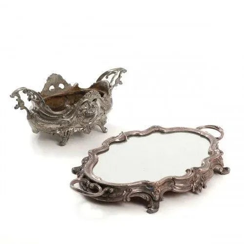 Louis XV style jardiniere made of silvered metal and set on a decorative plateau with a mirror. Decoration / setting of a...
