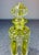 Beautiful cut crystal glass perfume bottle with stopper featuring a yellow art-deco style ribbon/panel design.