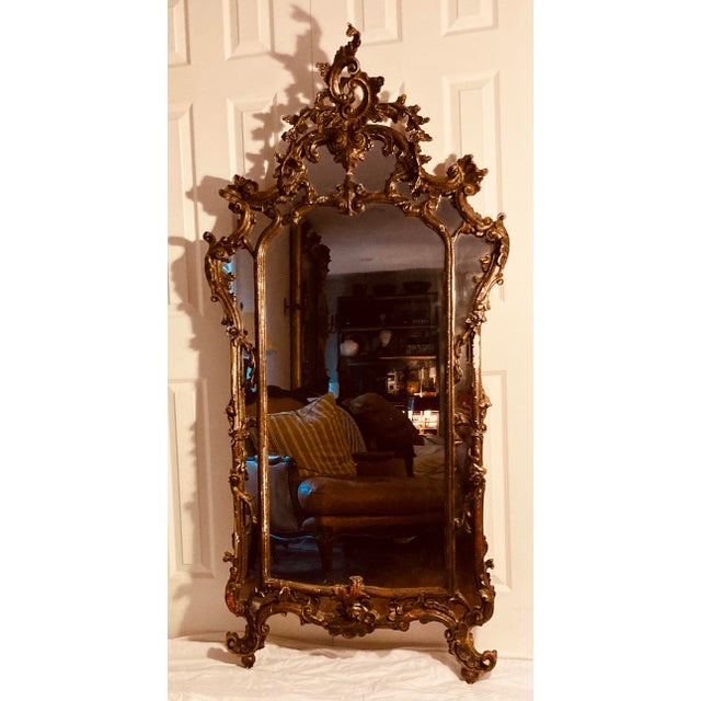 Large elaborately carved gilt Rococo walnut Venetian wall mirror
