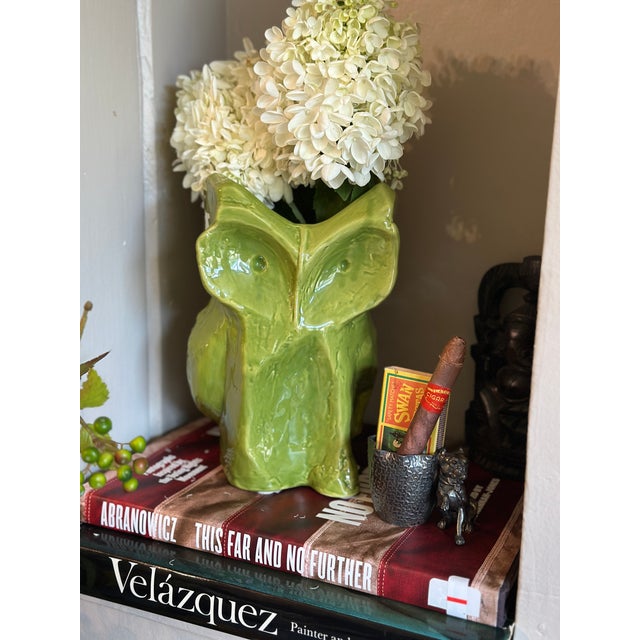 Ring bold personality and high-fashion whimsy to your space with the sculptural green Owl Vase from the coveted “After...