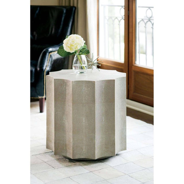 Embodying a refined simplicity, the Marilyn Shagreen Scalloped table features a modern frame paired with a faux shagreen...
