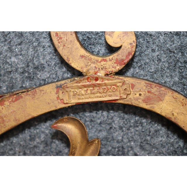 This striking pair of Palladio-style gilt mirrors is a beautiful interpretation of one of Italy's most celebrated...