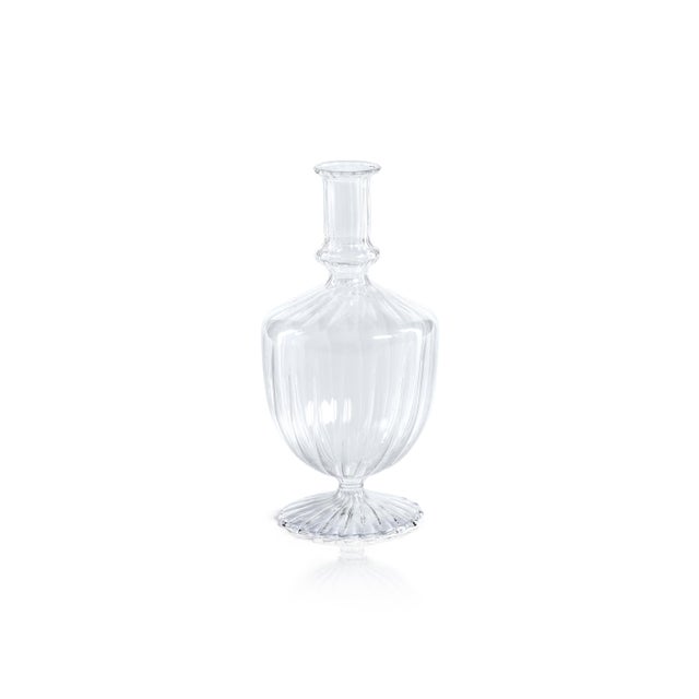 Made of glass, this set of 2 footed vases are a quaint touch to your home. Its exquisite craftsmanship and eye-catching...