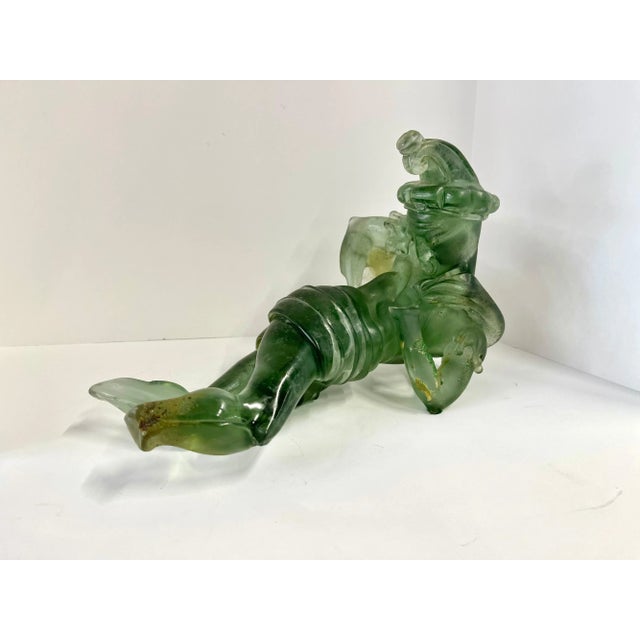 An Italian Murano glass figure of a jester in a Scavo finish attributed to Ermanno Nason for Cenedese. Typical of his...