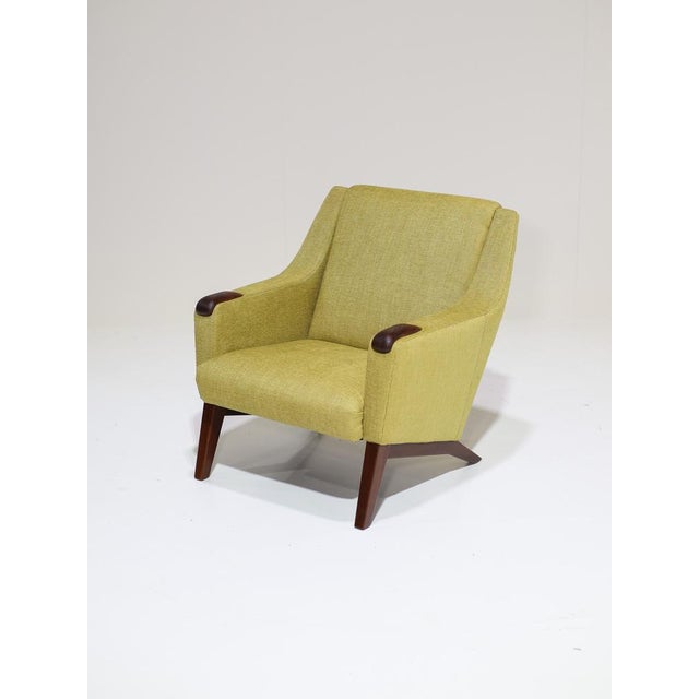 Set of two beautiful vintage armchairs made in Denmark, 1960s. This armchair is stylishly designed with beautiful wooden...