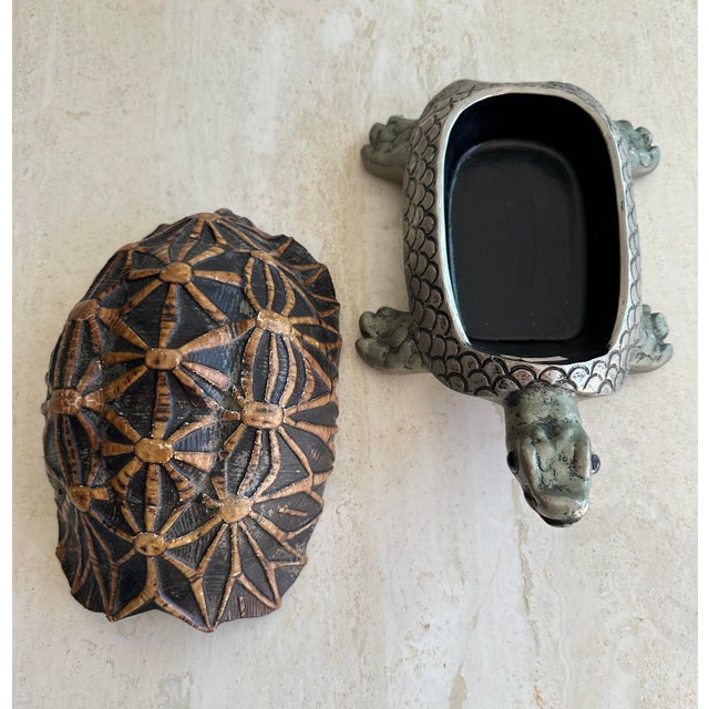 Detailed tortoise, lidded box, made in France. Its hidden interior makes this a great spot to keep valuables.