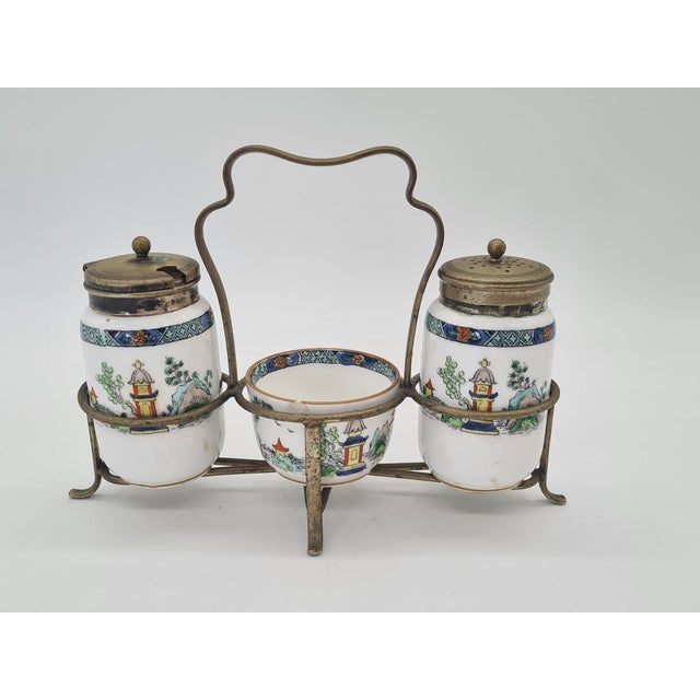 An elegant, unique 3-piece spice set by Crown Staffordshire, made of fine bone china and housed in a decorative metal...