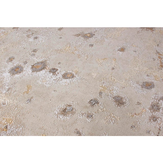 A contemporary piece with an abstract imagination from Rug & Kilim exemplifying a delicious beige-brown field with specs...