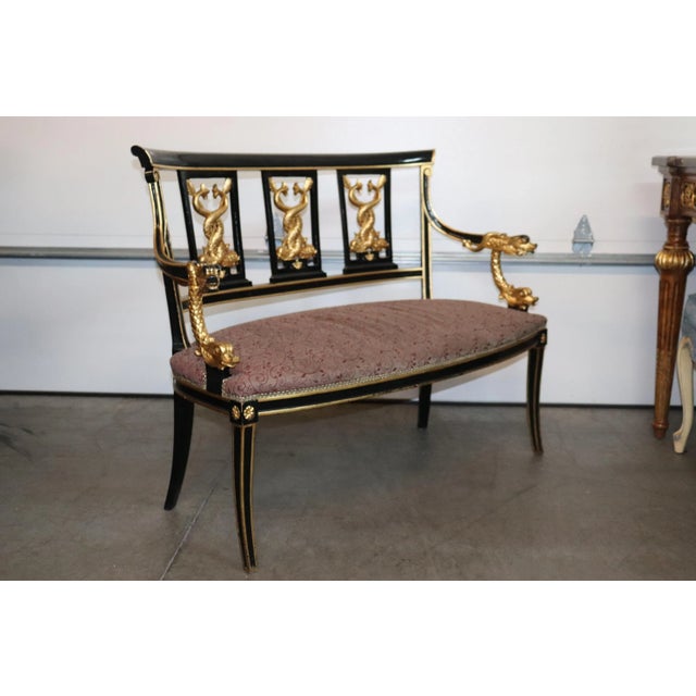 This is an outrageously beautiful French Empire settee. The settee is done in black lacquer and the carving is done in...