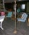 Gilt wrought iron with tubular glass rods and tripod base floor lamp from France.