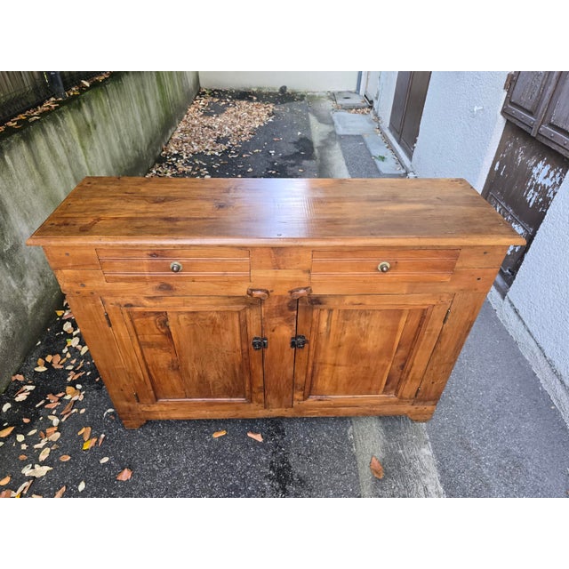 Superb antique solid cherry wood sideboard, boasting a magnificent golden patina and the warm grain typical of this noble...