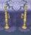 This pair of ornate French brass andirons, circa 1910, are comprised of elegantly stacked turned components. With...