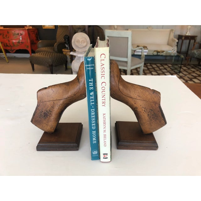 A marvelous pair of 19th century women's shoe molds that have been made into bookends. Walnut bases and original graphic...