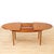 This vintage mid-century extending dining table was produced by Jentique in the 1960s. Made of teak, this extending dining...