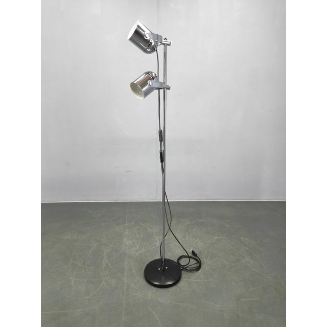 An original mid-century adjustable floor lamp designed by Stanislav Indra, produced in 1960s Czechoslovakia. This...