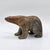 A substantial carved stone bear sculpture signed C. Olivier and dated 1998. The piece has a simplified modernist animal...
