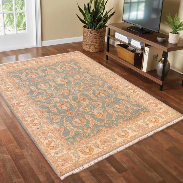 "Enhance the ambiance of your home with this magnificent Persian-influenced Turkish hand-knotted rug made by skilled...