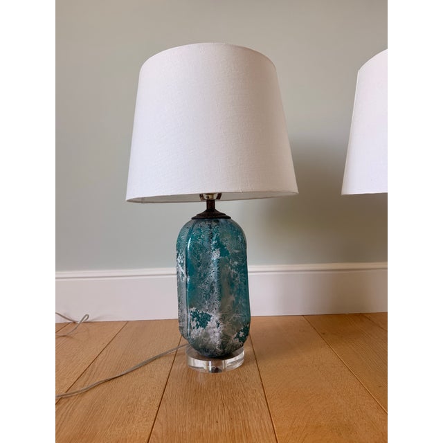 Beautiful pair of ice blue Murano. Carved shape. Acid wash texture that gives each piece depth. Deep aqua blue. Mounted on...