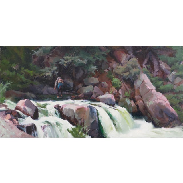 Cold Feet by Judd Mercer | Oil on Wood Panel man standing near a waterfall and rocky riverbank For Sale