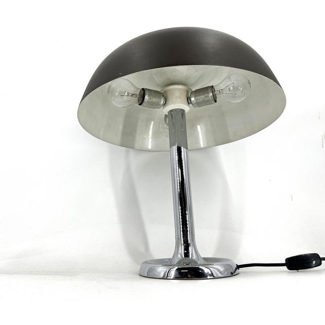 Space age design table lamp designed by Egon Hillebrand consisting of a beautiful chromed base and abrown aluminum lamp...