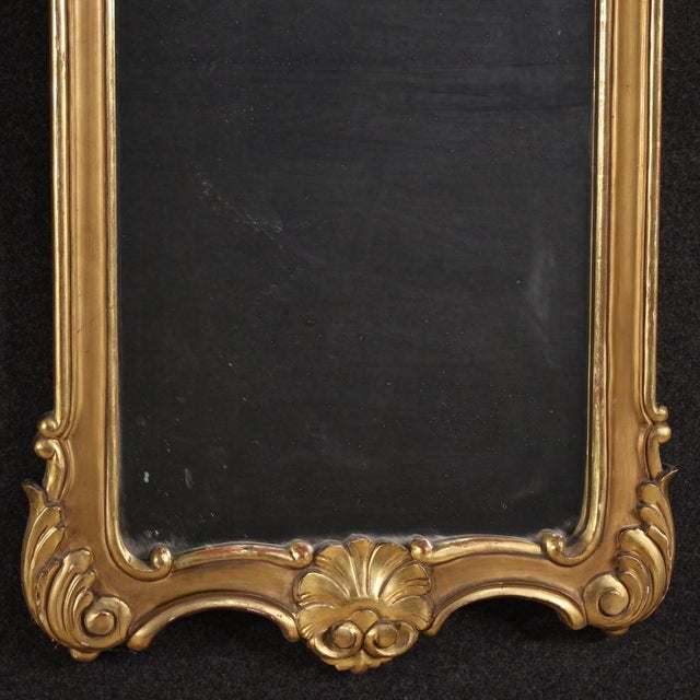 Mid-20th-century Italian mirror. Beautifully proportioned and elegant, antique-style furniture made of finely carved,...
