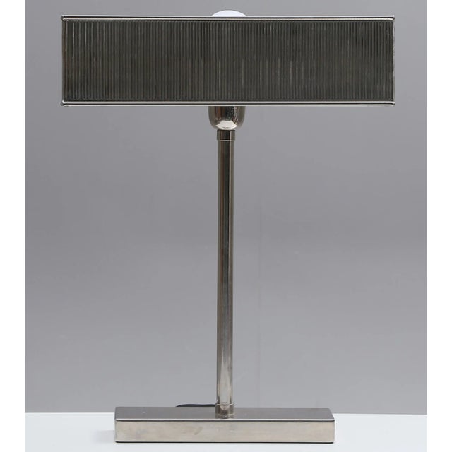 Vintage table lamp, late 70s, white metal and aluminum. The lamp works. European Plug (up to 250V).The wiring of this item...