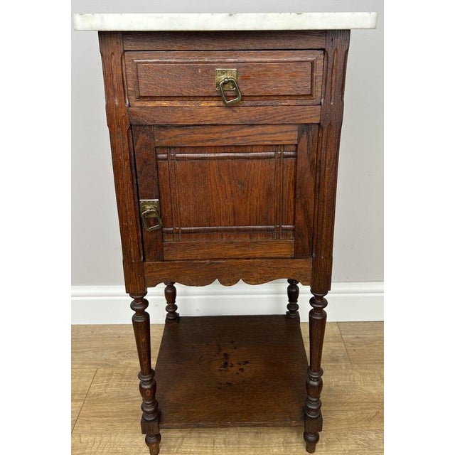 Add timeless French character to your home with this Antique French bedside table , crafted from oak and topped with a...