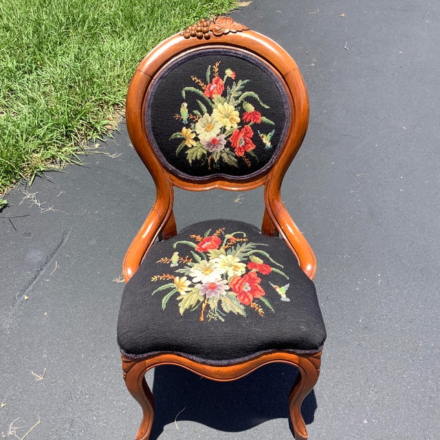 Antique Victorian Needlepoint Chair. Full needlepoint of flowers on back and seat with a black background. Grape Motif...
