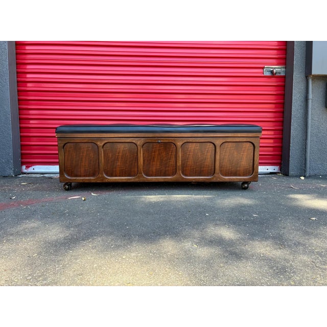 Vintage mid century cedar chest by Lane featuring stunning rich walnut wood grain and clean architectural lines. The top...