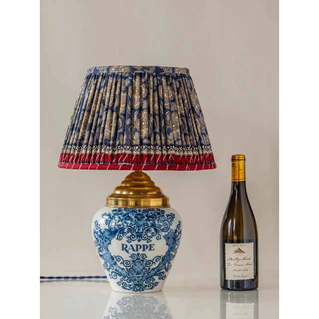 Meet Rappe, a one-of-a-kind table lamp handcrafted from a rare, vintage Royal Tichelaar Makkum Delft tobacco jar, dating...