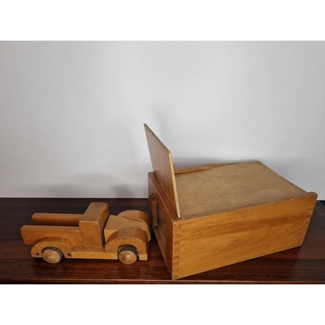 The extremely rare garage including the vehicle and converter from the 1950s from Kay Bojesen. This piece has an...