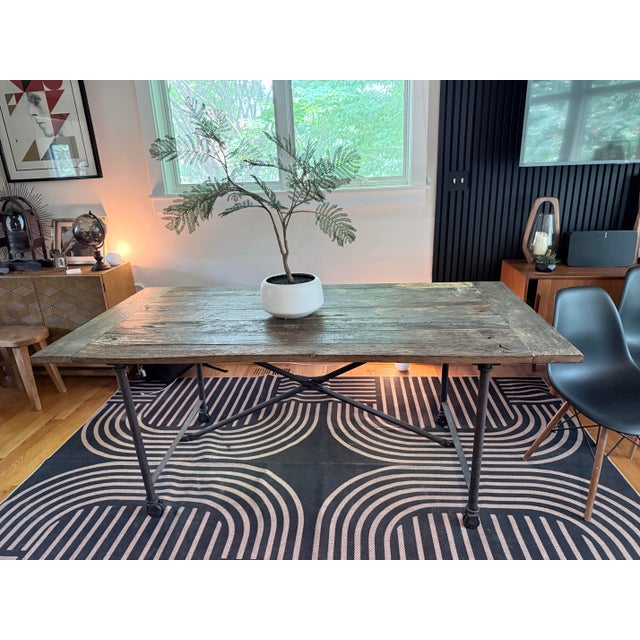 see pictures for details Description: The Restoration Hardware FLATIRON Reclaimed Wood and Iron Dining Table is a stylish...