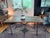 see pictures for details Description: The Restoration Hardware FLATIRON Reclaimed Wood and Iron Dining Table is a stylish...