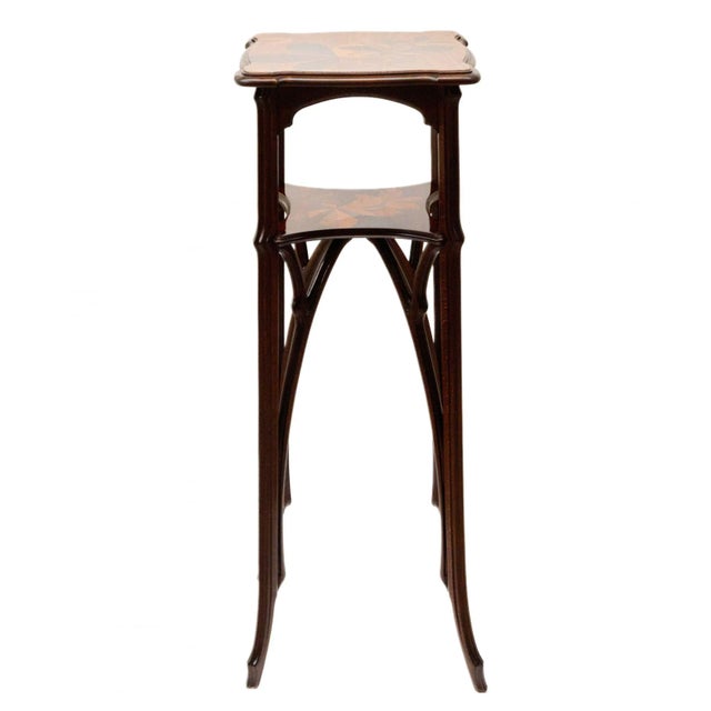 Two-tier pedestal for flowers made of solid walnut, Art Nouveau style. 20th century. Combines germination, bamboo, and...